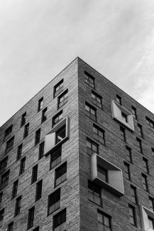 Black and white photo of a brick office building